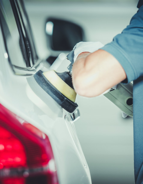 Auto Repair Technician Polishing SUV